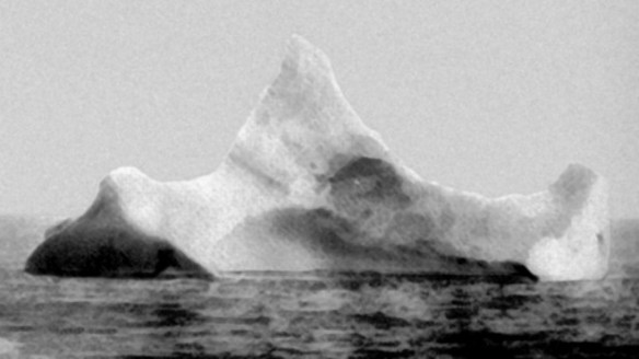 This is believed to be the iceberg that Sank the Titanic. Photo taken after the collision, showing signs of collision and red paint. Courtesy US Coast Guard